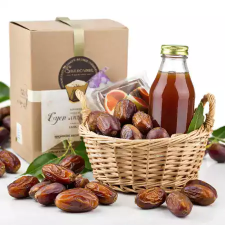 Eco-friendly packaging process at EcoDateFarm's Jaisalmer facility where premium Medjool dates are carefully packed for delivery across India