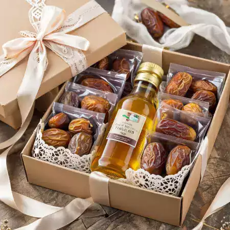 Elegant gift boxes containing premium Medjool dates from EcoDateFarm's Jaisalmer plantation, perfect for festivals and special occasions